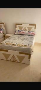 a bed in a room with a bed frame at Villaggio lavie in Ras Sedr +30 photos
