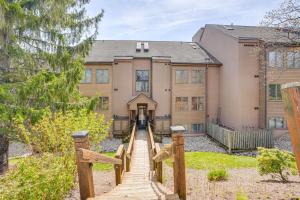 a house with a staircase leading to the front of it at Pool Access: Scenic Condo in Wintergreen Resort! in Mount Torry Furnace