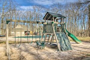 a playground with a ladder and a slide at Pool Access: Scenic Condo in Wintergreen Resort! in Mount Torry Furnace