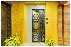 a front door of a building with a metal gate at VARANASI HOTEL PV LUXUARY Near Kashi Vishwanath temple - A Luxuary Hotel In Varanasi in Varanasi