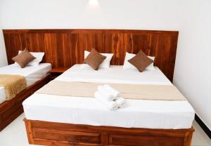 Postel nebo postele na pokoji v ubytování Liyon Hotel