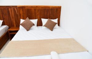 Postel nebo postele na pokoji v ubytování Liyon Hotel
