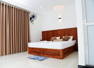 Postel nebo postele na pokoji v ubytování Liyon Hotel