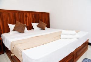 Postel nebo postele na pokoji v ubytování Liyon Hotel