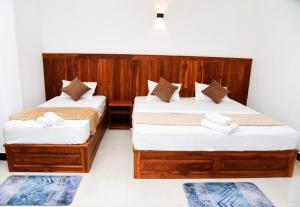 Postel nebo postele na pokoji v ubytování Liyon Hotel