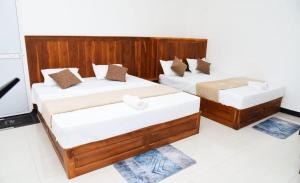 Postel nebo postele na pokoji v ubytování Liyon Hotel
