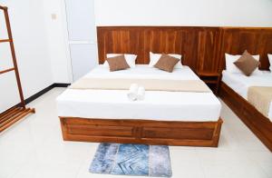 Postel nebo postele na pokoji v ubytování Liyon Hotel
