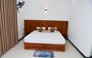 Postel nebo postele na pokoji v ubytování Liyon Hotel