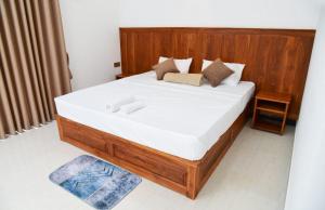 Postel nebo postele na pokoji v ubytování Liyon Hotel