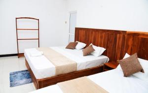 Postel nebo postele na pokoji v ubytování Liyon Hotel
