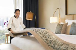 Postel nebo postele na pokoji v ubytování Kempinski Hotel Fuzhou