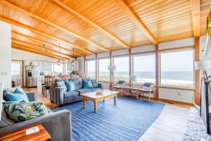 a living room with a view of the ocean at Sands of Time in Lincoln City