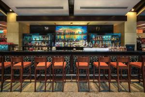 a bar with orange chairs in a room at Kempinski Hotel Chengdu-City Center in Chengdu +160 photos