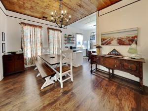 a dining room with a table and a desk at The Vintage Sea Turtle in Galveston
