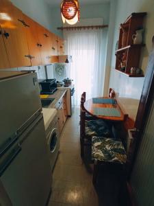 Kuchyň nebo kuchyňský kout v ubytování Carnations Studio + 5 fotografií