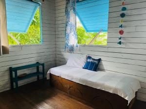 Postel nebo postele na pokoji v ubytování Maison en bois