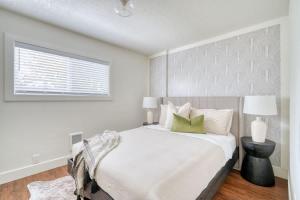 a white bedroom with a large bed and a window at Stay Portland - Beautiful Brooklyn 1 Bed Apt in Portland +34 photos