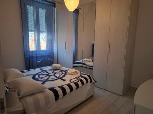 a bedroom with a bed and a window at Casa Carlo La Spezia in La Spezia