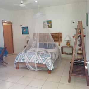 Postel nebo postele na pokoji v ubytování Mayan Bungalow Near Chichén