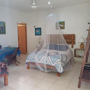 Voodi või voodid majutusasutuse Mayan Bungalow Near Chichén toas
