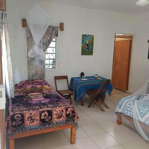 Voodi või voodid majutusasutuse Mayan Bungalow Near Chichén toas