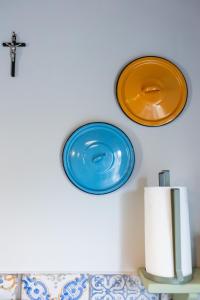 two plates are hanging on the wall at Palazzo San Biagio in Viterbo +178 photos