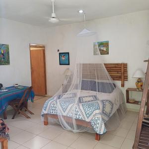 Voodi või voodid majutusasutuse Mayan Bungalow Near Chichén toas