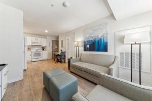 a living room with a couch and a table at Properties By Preston I Spacious 1 Bed 1 Bth in San Antonio
