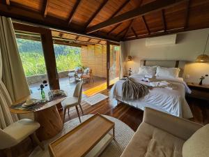 Cama ou camas em um quarto em I'Lumiar Loft