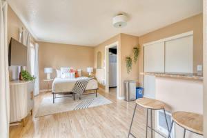 a living room with a bed and a table and chairs at Stay Portland - John's Landing Haven - Studio Near OHSU in Marquam Hill