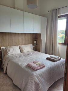 Postel nebo postele na pokoji v ubytování Bella Todi Apartment