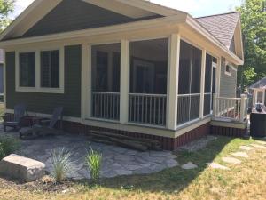 a screened in porch on a house at The Chorus Frog - 8 Hollow in Cherry Valley