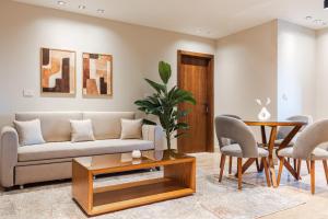 a living room with a couch and a table at Elegance Tower in Cairo