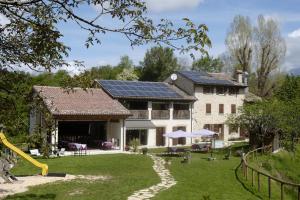 a house with solar panels on the roof at Agriturismo Col Maor in Pieve