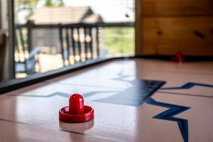 a red heart toy on the floor of a pool at Bear Monkey Lodge by Avada Properties in Sevierville