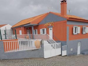 a house with an orange and gray at Encanto da Aldeia in Torre de Moncorvo