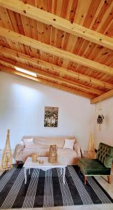 a living room with a couch and a table at MARY'S HOUSE - Urban Promenade Vibes in Tripolis