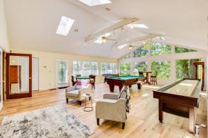 a living room with a pool table and some windows at Deck and Game Room Mountaintop Hideaway in Tiger! in Tiger