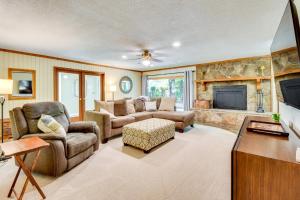 a living room with a couch and a fireplace at Deck and Game Room Mountaintop Hideaway in Tiger! in Tiger