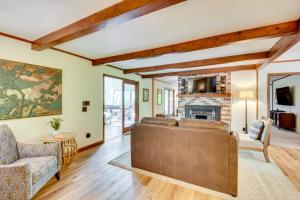 a living room with a couch and a fireplace at Deck and Game Room Mountaintop Hideaway in Tiger! in Tiger
