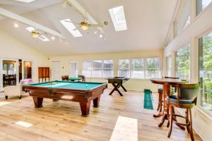 a room with a pool table and some windows at Deck and Game Room Mountaintop Hideaway in Tiger! in Tiger