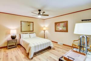 a bedroom with a bed and a ceiling fan at Deck and Game Room Mountaintop Hideaway in Tiger! in Tiger