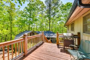 a wooden deck with a grill on a house at Deck and Game Room Mountaintop Hideaway in Tiger! in Tiger