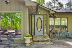 a front door of a house with a mirror and two bikes at Deck and Game Room Mountaintop Hideaway in Tiger! in Tiger