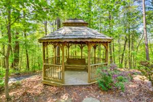 a gazebo in the middle of the woods at Deck and Game Room Mountaintop Hideaway in Tiger! in Tiger