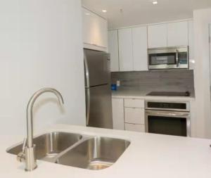 Kuchyň nebo kuchyňský kout v ubytování Cómodo apartamento brickell