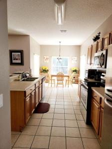 a kitchen with a sink and a counter top at Home Away From Home in Kissimmee