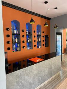 a bar in a restaurant with blue shelves at LOL-HA Hotel Boutique in Cancún