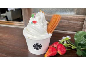 a cup of whipped cream and strawberries on a table at TAKAYANAGI JONNOBI VILLAGE - Vacation STAY 90850v in Kashiwazaki