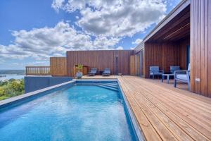 a swimming pool on the deck of a house at Caju Villas Montargil - Villa Pedra Furada in Montargil